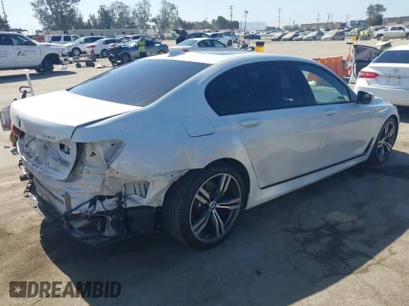 2019 BMW 7 Series 740i with VIN WBA7E2C53KB454816, listed as a IAAI auction lot 42539294 with 73,363 mi miles and . Bid and sale history available at DreamBid. Image 4.