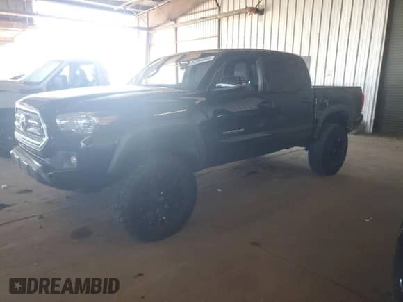 2016 Toyota Tacoma SR5 with VIN 3TMAZ5CN4GM003232, listed as a Copart auction lot 82364945 with 142,997 mi miles and Salvage title. Bid and sale history available at DreamBid. Image 1.