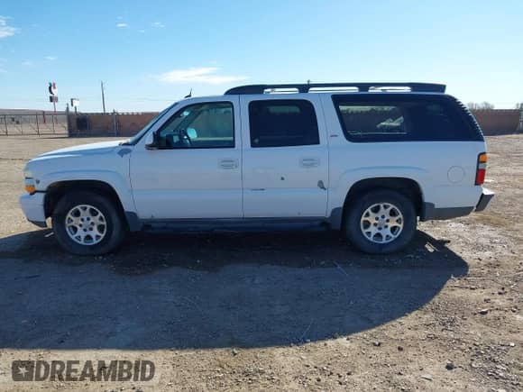 2005 Chevrolet Suburban LT z VIN 3GNEC16Z95G288863, wystawiony jako IAAI lot #41653675 z przebiegiem 309 977 mil mil oraz . Historia ofert i sprzedaży dostępna na DreamBid. Obrazek 14.