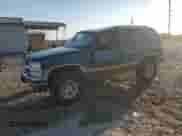 1995 Chevrolet Tahoe with VIN 3GNEK18K7SG119164, listed as a Copart auction lot 77744684 with 165,798 mi miles and Salvage title. Bid and sale history available at DreamBid. Image 1.