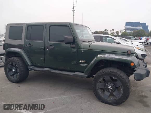 2007 Jeep Wrangler Unlimited Sahara z VIN 1J4GA59147L218594, wystawiony jako IAAI lot #42984397 z przebiegiem 108 296 mil mil oraz . Historia ofert i sprzedaży dostępna na DreamBid. Obrazek 14.