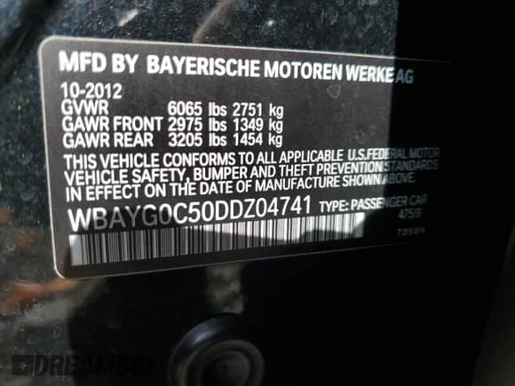 2013 BMW 7 Series with VIN WBAYG0C50DDZ04741, listed as a Copart auction lot 77791104 with 55,658 mi miles and Salvage title. Bid and sale history available at DreamBid. Image 13.