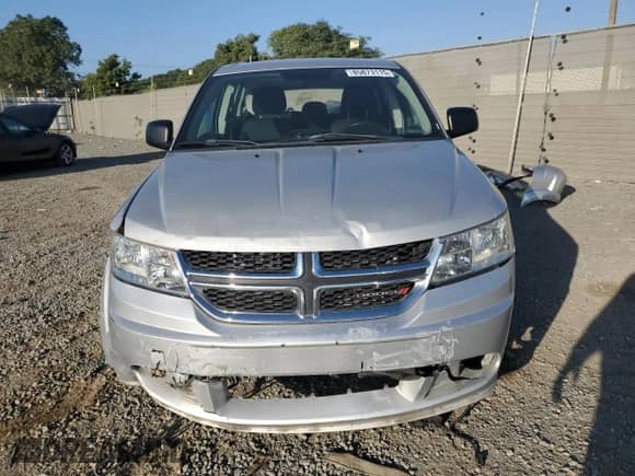 2013 Dodge Journey American Value с VIN 3C4PDCAB2DT671814, выставлен на аукционе Copart как лот 82746025 с пробегом 118 890 миль миль и Списание • Salvage title. История ставок и продаж доступна на DreamBid. Изображение 5.