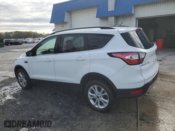 2018 Ford Escape SE z VIN 1FMCU9GDXJUC76982, wystawiony jako Copart lot #87299125 z przebiegiem 88 151 mil mil oraz Czysty tytuł • Clean title. Historia ofert i sprzedaży dostępna na DreamBid. Obrazek 2.