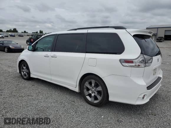 2014 Toyota Sienna SE with VIN 5TDXK3DCXES431576, listed as a Copart auction lot 69655795 with 221,877 mi miles and Salvage title. Bid and sale history available at DreamBid. Image 2.