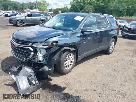 2018 Chevrolet Traverse LT Cloth z VIN 1GNEVGKW5JJ238396, wystawiony jako IAAI lot #42748487 z przebiegiem 72 675 mil mil oraz . Historia ofert i sprzedaży dostępna na DreamBid. Obrazek 2.
