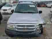 2002 Chevrolet Tracker with VIN 2CNBE13C926934704, listed as a Copart auction lot 70717194 with 189,076 mi miles and Salvage title. Bid and sale history available at DreamBid. Image 5.