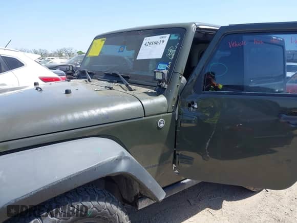 2015 Jeep Wrangler Sport with VIN 1C4AJWAGXFL650428, listed as a IAAI auction lot 42010629 with 80,039 mi miles and . Bid and sale history available at DreamBid. Image 6.