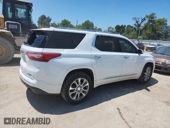 2018 Chevrolet Traverse Premier с VIN 1GNERKKW8JJ100097, выставлен на аукционе Copart как лот 64028145 с пробегом 169 371 миль миль и Списание • Salvage title. История ставок и продаж доступна на DreamBid. Изображение 3.