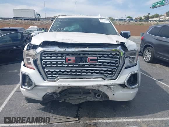 2021 GMC Sierra 1500 Denali with VIN 3GTU9FEL1MG349215, listed as a IAAI auction lot 42268438 with 97,465 mi miles and . Bid and sale history available at DreamBid. Image 12.