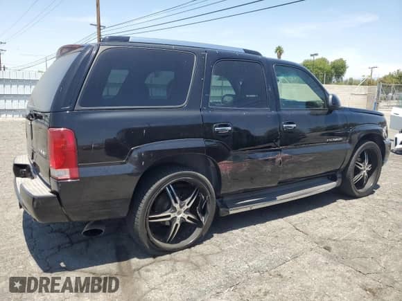 2002 Cadillac Escalade with VIN 1GYEC63T42R189976, listed as a Copart auction lot 57852565 with 243,089 mi miles and Salvage title. Bid and sale history available at DreamBid. Image 3.