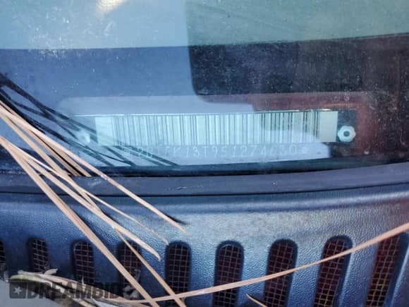 2005 GMC Sierra 1500 SLE with VIN 2GTEK13T951274630, listed as a Copart auction lot 82576965 with 294,879 mi miles and Salvage title. Bid and sale history available at DreamBid. Image 12.