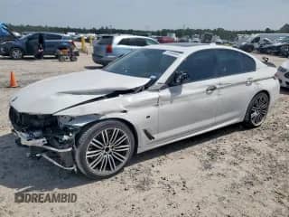 2018 BMW 5 Series M550i xDrive with VIN WBAJB9C51JG463894, listed as a Copart auction lot 67049045 with 30,962 mi miles and Salvage title. Bid and sale history available at DreamBid. Image 1.