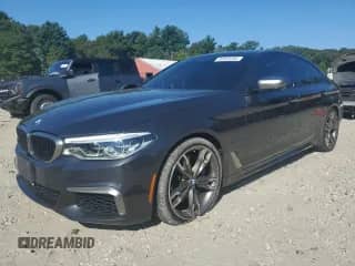 2018 BMW 5 Series M550i xDrive with VIN WBAJB9C50JB286221, listed as a Copart auction lot 80460595 with 115,587 mi miles and Salvage title. Bid and sale history available at DreamBid. Image 1.