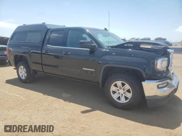 2019 GMC Sierra 1500 SLE with VIN 2GTV2MECXK1127002, listed as a Copart auction lot 61127735 with 63,923 mi miles and Salvage title. Bid and sale history available at DreamBid. Image 4.