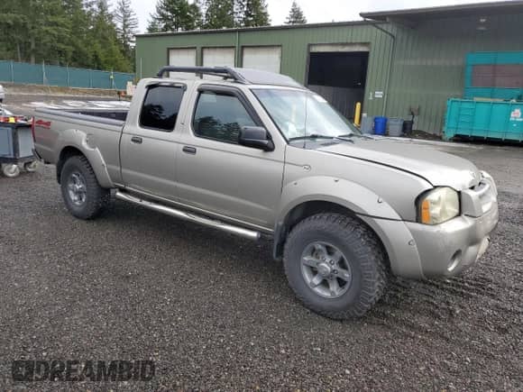 2003 Nissan Frontier XE with VIN 1N6ED29Y43C414977, listed as a Copart auction lot 43938595 with 212,303 mi miles and Salvage title. Bid and sale history available at DreamBid. Image 4.
