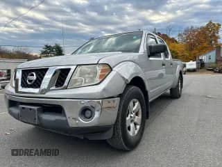 2009 Nissan Frontier SE with VIN 1N6AD09W89C411798, listed as a Copart auction lot 77967144 with 210,803 mi miles and Clean title. Bid and sale history available at DreamBid. Image 1.