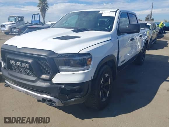 2022 Ram 1500 Rebel z VIN 1C6SRFLT4NN158883, wystawiony jako IAAI lot #43517383 z przebiegiem 45 447 mil mil oraz . Historia ofert i sprzedaży dostępna na DreamBid. Obrazek 2.