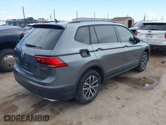 2021 Volkswagen Tiguan S z VIN 3VV0B7AX0MM017433, wystawiony jako IAAI lot #42017125 z przebiegiem 54 624 mil mil oraz . Historia ofert i sprzedaży dostępna na DreamBid. Obrazek 4.