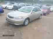 2006 Toyota Camry STD z VIN 4T1BE32K56U152590, wystawiony jako IAAI lot #43165402 z przebiegiem 164 696 mil mil oraz . Historia ofert i sprzedaży dostępna na DreamBid. Obrazek 2.