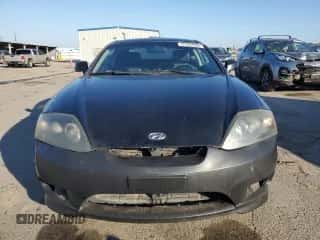 2006 Hyundai Tiburon GT с VIN KMHHN65F46U217049, выставлен на аукционе Copart как лот 87972565 с пробегом 88 945 миль миль и Чистый • Clean title. История ставок и продаж доступна на DreamBid. Изображение 5.