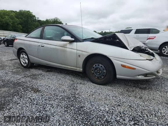 2002 Saturn SC с VIN 1G8ZY127X2Z290823, выставлен на аукционе Copart как лот 58144795 с пробегом 219 775 миль миль и Списание • Salvage title. История ставок и продаж доступна на DreamBid. Изображение 4.