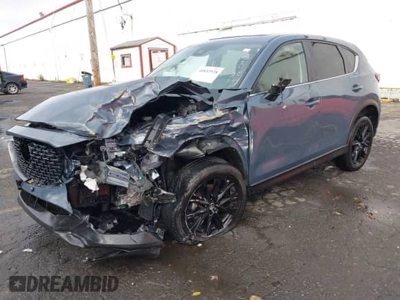 2023 Mazda CX-5 S Carbon Edition z VIN JM3KFBCM2P0212062, wystawiony jako IAAI lot #40853928 z przebiegiem 25 463 mil mil oraz . Historia ofert i sprzedaży dostępna na DreamBid. Obrazek 2.