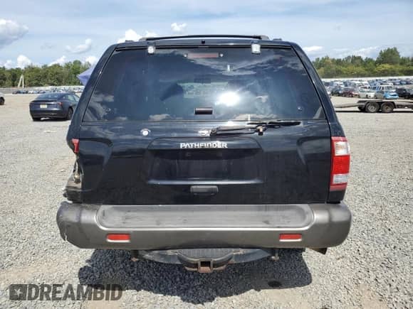 1999 Nissan Pathfinder XE with VIN JN8AR07Y5XW366845, listed as a Copart auction lot 70597005 with 182,350 mi miles and Salvage title. Bid and sale history available at DreamBid. Image 6.
