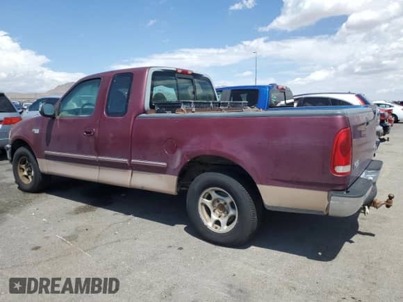 1997 Ford F-150 XL z VIN 1FTEX17L2VNB18102, wystawiony jako Copart lot #66221125 z przebiegiem 172 793 mil mil oraz Szkoda całkowita • Salvage title. Historia ofert i sprzedaży dostępna na DreamBid. Obrazek 2.