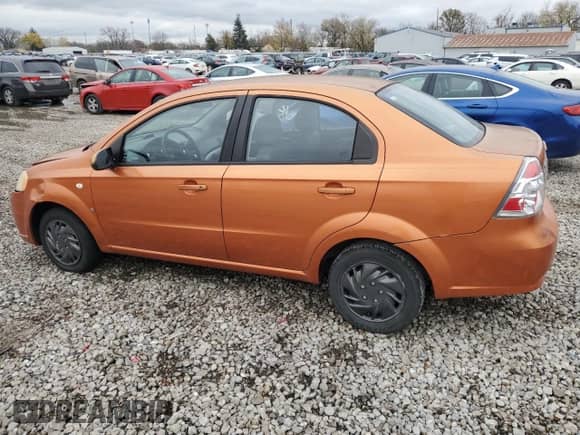 2007 Chevrolet Aveo LS z VIN KL1TD56637B057387, wystawiony jako Copart lot #77928504 z przebiegiem 129 014 mil mil oraz Szkoda całkowita • Salvage title. Historia ofert i sprzedaży dostępna na DreamBid. Obrazek 2.
