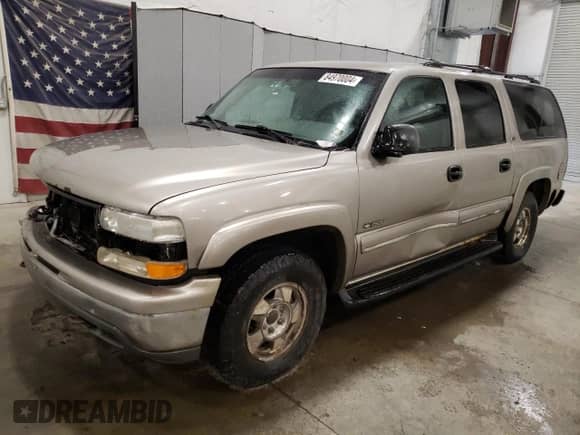 2000 Chevrolet Suburban with VIN 1GNFK16T9YJ169393, listed as a Copart auction lot 84970004 with 304,002 mi miles and Salvage title. Bid and sale history available at DreamBid. Image 1.