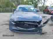 2022 Mazda CX-5 S Carbon Edition z VIN JM3KFBCM3N0551653, wystawiony jako IAAI lot #41495011 z przebiegiem 49 842 mil mil oraz . Historia ofert i sprzedaży dostępna na DreamBid. Obrazek 13.