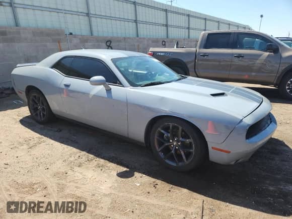 2021 Dodge Challenger SXT с VIN 2C3CDZAG1MH582424, выставлен на аукционе Copart как лот 70219745 с пробегом 64 465 миль миль и Списание • Salvage title. История ставок и продаж доступна на DreamBid. Изображение 4.