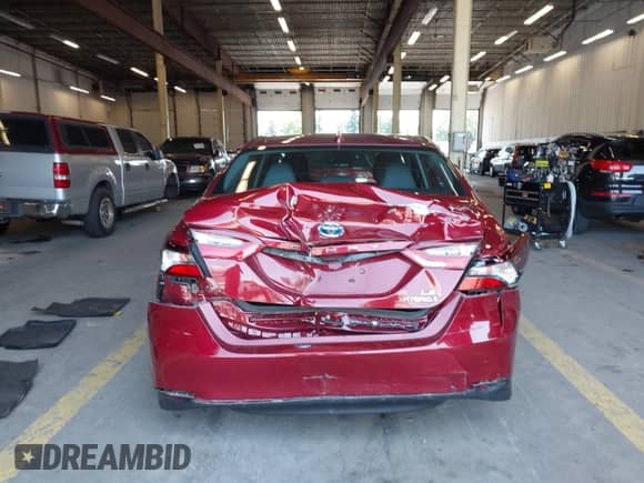 2022 Toyota Camry Hybrid LE with VIN 4T1C31AK7NU585634, listed as a IAAI auction lot 42443856 with 31,756 mi miles and . Bid and sale history available at DreamBid. Image 16.