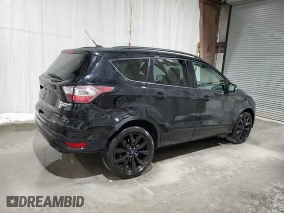 2017 Ford Escape Titanium с VIN 1FMCU9JD2HUD17267, выставлен на аукционе Copart как лот 86828485 с пробегом 72 989 миль миль и Списание • Salvage title. История ставок и продаж доступна на DreamBid. Изображение 3.