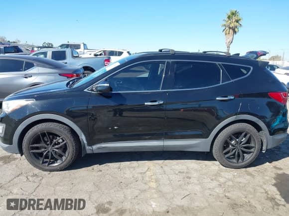 2014 Hyundai Santa Fe with VIN 5XYZUDLAXEG151453, listed as a IAAI auction lot 43479084 with 127,090 mi miles and . Bid and sale history available at DreamBid. Image 14.