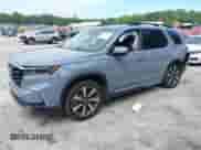 2025 Honda Pilot Touring with VIN 5FNYG2H70SB011614, listed as a IAAI auction lot 42205848 with 37,719 mi miles and . Bid and sale history available at DreamBid. Image 2.