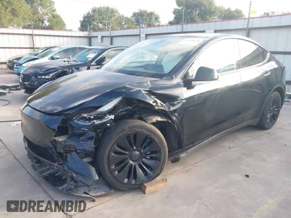 2023 Tesla Model Y Long Range z VIN 7SAYGAEE7PF767951, wystawiony jako IAAI lot #43128878 z przebiegiem 36 431 mil mil oraz . Historia ofert i sprzedaży dostępna na DreamBid. Obrazek 24.