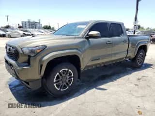2024 Toyota Tacoma SR5 with VIN 3TMLB5FN1RM001210, listed as a Copart auction lot 61857315 with 26,388 mi miles and Salvage title. Bid and sale history available at DreamBid. Image 1.