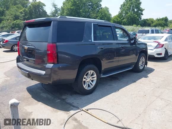 2015 Chevrolet Tahoe LTZ with VIN 1GNSKCKC2FR588524, listed as a IAAI auction lot 42851274 with 101,426 mi miles and . Bid and sale history available at DreamBid. Image 4.