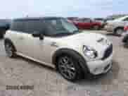 2009 MINI Hardtop S with VIN WMWMF73569TW87347, listed as a Copart auction lot 59445035 with 118,336 mi miles and Salvage title. Bid and sale history available at DreamBid. Image 4.