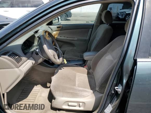 2003 Toyota Camry LE z VIN JTDBE32K230238074, wystawiony jako Copart lot #80206215 z przebiegiem 169 654 mil mil oraz Szkoda całkowita • Salvage title. Historia ofert i sprzedaży dostępna na DreamBid. Obrazek 7.