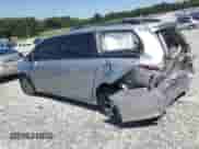 2012 Toyota Sienna SE with VIN 5TDXK3DC9CS183950, listed as a Copart auction lot 70873765 with 180,359 mi miles and Salvage title. Bid and sale history available at DreamBid. Image 2.