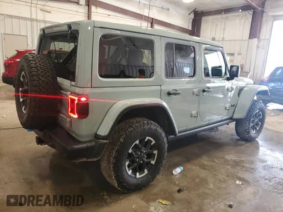 2024 Jeep Wrangler Rubicon with VIN 1C4RJXR66RW100859, listed as a Copart auction lot 58377805 with 9,426 mi miles and Salvage title. Bid and sale history available at DreamBid. Image 3.
