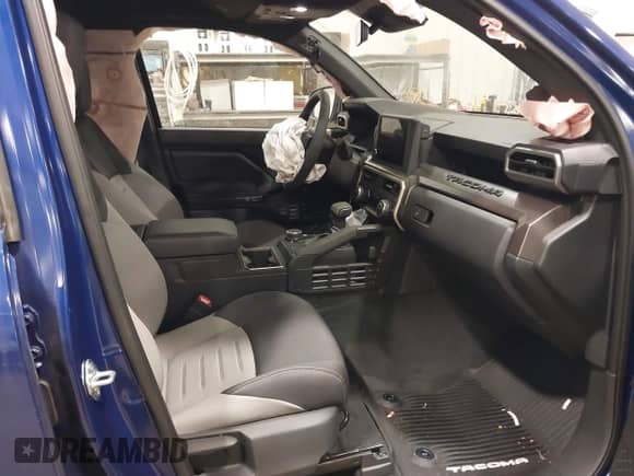 2024 Toyota Tacoma SR5 with VIN 3TMLB5JN3RM054207, listed as a IAAI auction lot 41171946 with 3,808 mi miles and . Bid and sale history available at DreamBid. Image 5.