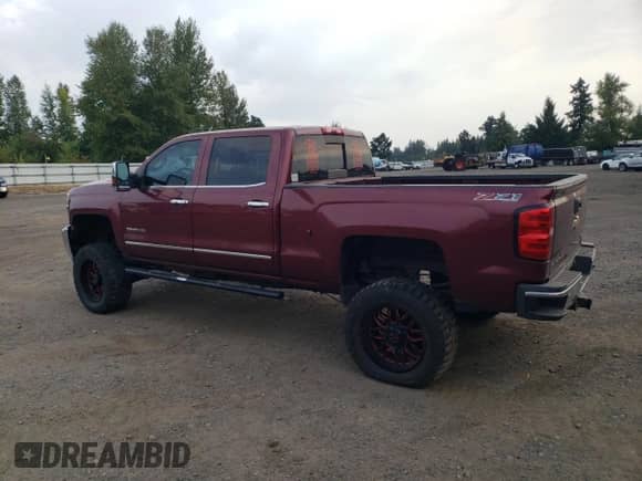 2015 Chevrolet Silverado 3500HD LTZ with VIN 1GC4K0C89FF558397, listed as a Copart auction lot 71624745 with 214,693 mi miles and Salvage title. Bid and sale history available at DreamBid. Image 2.