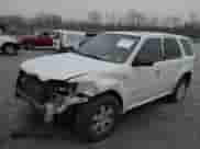 2008 Mercury Mariner with VIN 4M2CU91128KJ03668, listed as a IAAI auction lot 41213830 with 240,480 mi miles and . Bid and sale history available at DreamBid. Image 2.