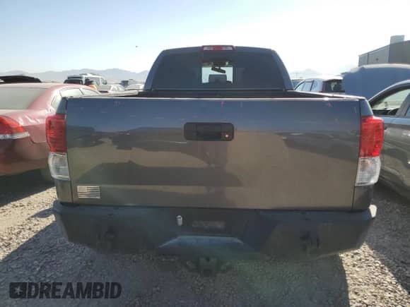 2012 Toyota Tundra с VIN 5TFUM5F14CX038703, выставлен на аукционе Copart как лот 69656085 с пробегом Не указан миль и Списание • Salvage title. История ставок и продаж доступна на DreamBid. Изображение 6.