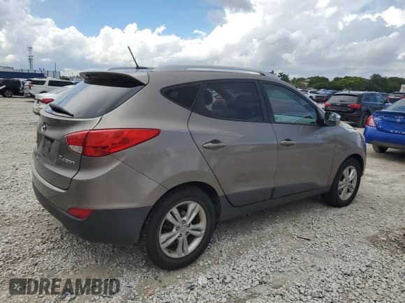 2012 Hyundai Tucson GLS z VIN KM8JU3AC6CU488866, wystawiony jako Copart lot #83814925 z przebiegiem 148 750 mil mil oraz Szkoda całkowita • Salvage title. Historia ofert i sprzedaży dostępna na DreamBid. Obrazek 3.