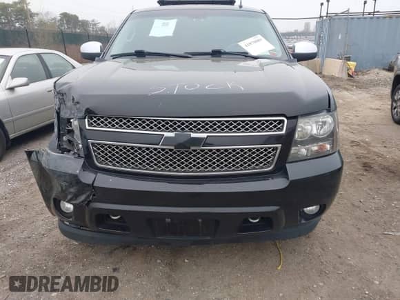 2014 Chevrolet Tahoe LTZ with VIN 1GNSKCE07ER142112, listed as a IAAI auction lot 41870089 with 168,575 mi miles and . Bid and sale history available at DreamBid. Image 12.